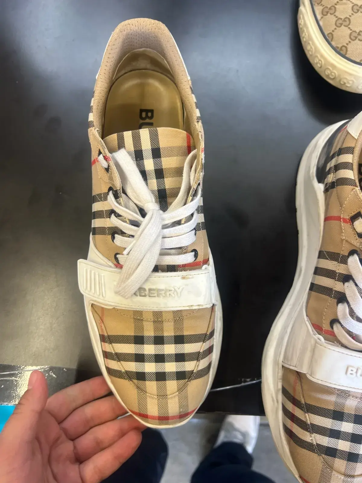 Burberry Vintage Check sneakers before cleaning, with dingy white leather and sole at Baroni Cleaners Irvine