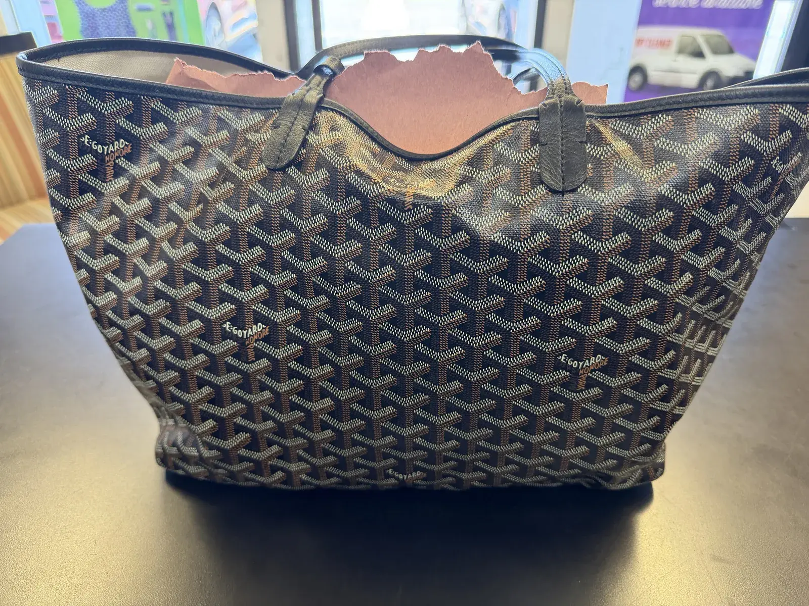 Cleaned Goyard chevron canvas and black leather trim at the tote opening, pattern definition restored