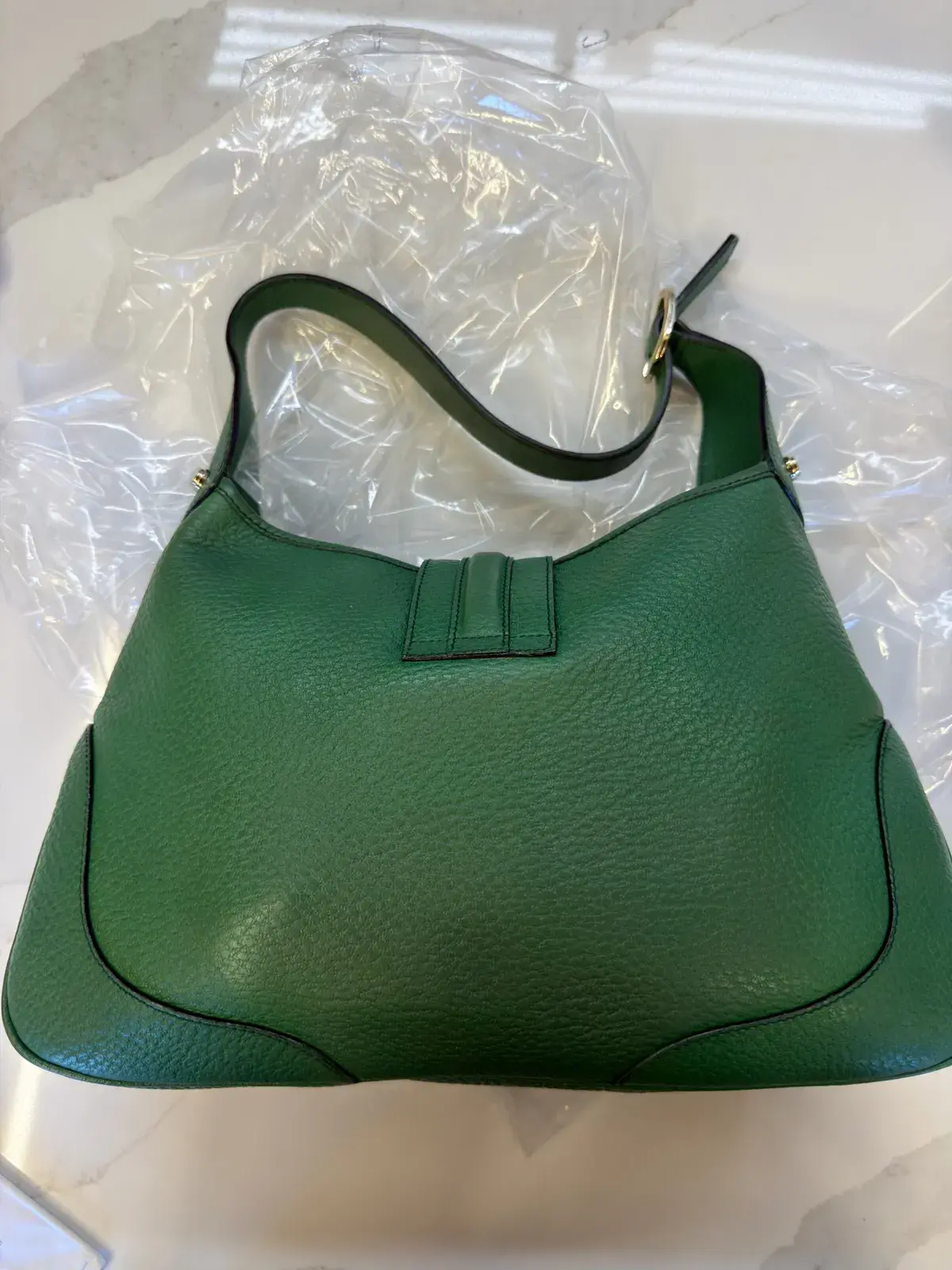 Back of the cleaned green leather Gucci Jackie, the two dark oil spots gone from the lower panel and the pebble grain intact