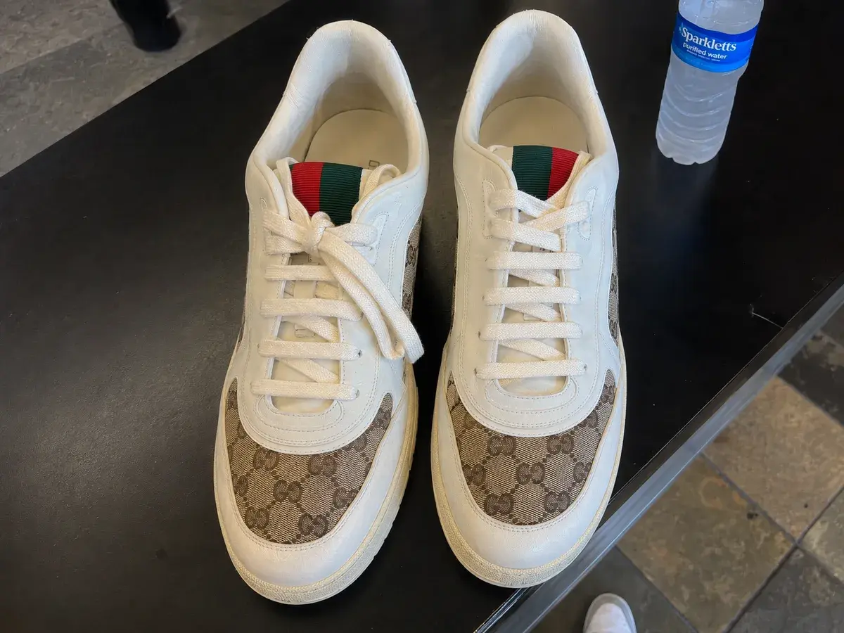 Gucci GG monogram sneakers after professional deep cleaning, white leather brightened and GG canvas restored at Baroni Cleaners Irvine