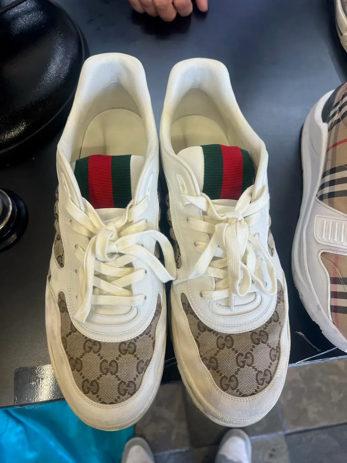 Gucci GG monogram sneakers before cleaning, with dingy white leather and grayed toes at Baroni Cleaners Irvine