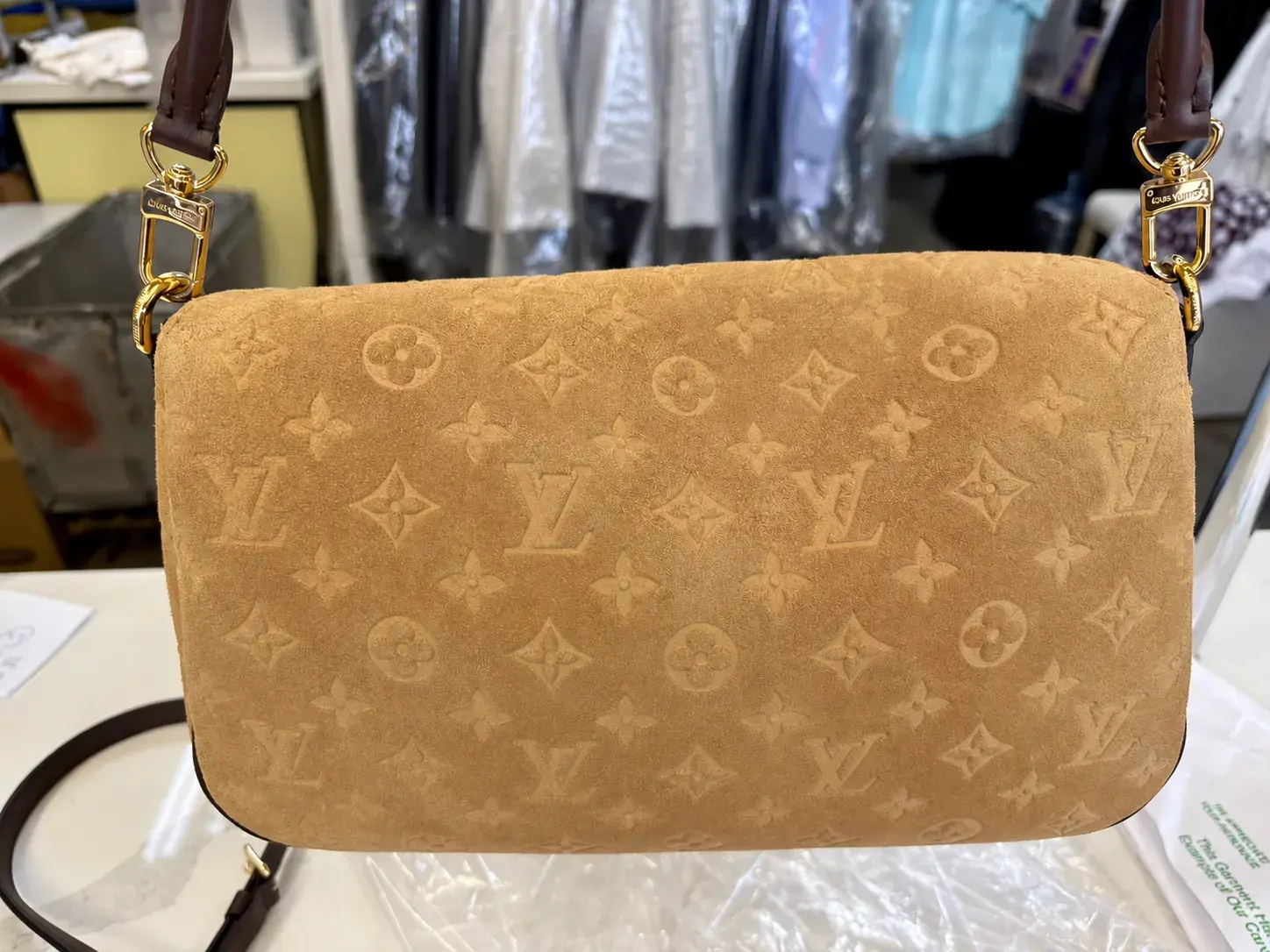 Back of the cleaned Louis Vuitton Pochette Métis Soft MM, the embossed Monogram suede even beige with the nap brushed up