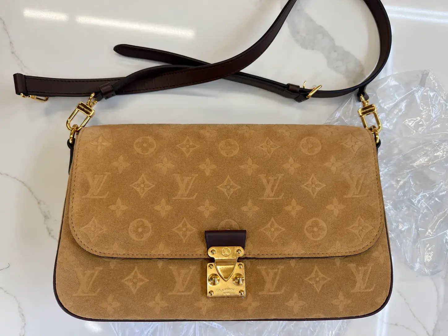 The same Louis Vuitton Pochette Métis Soft MM after dye transfer removal at Baroni Cleaners Irvine, Beige Trench Monogram suede one even tone with its Chocolate strap and gold S-lock