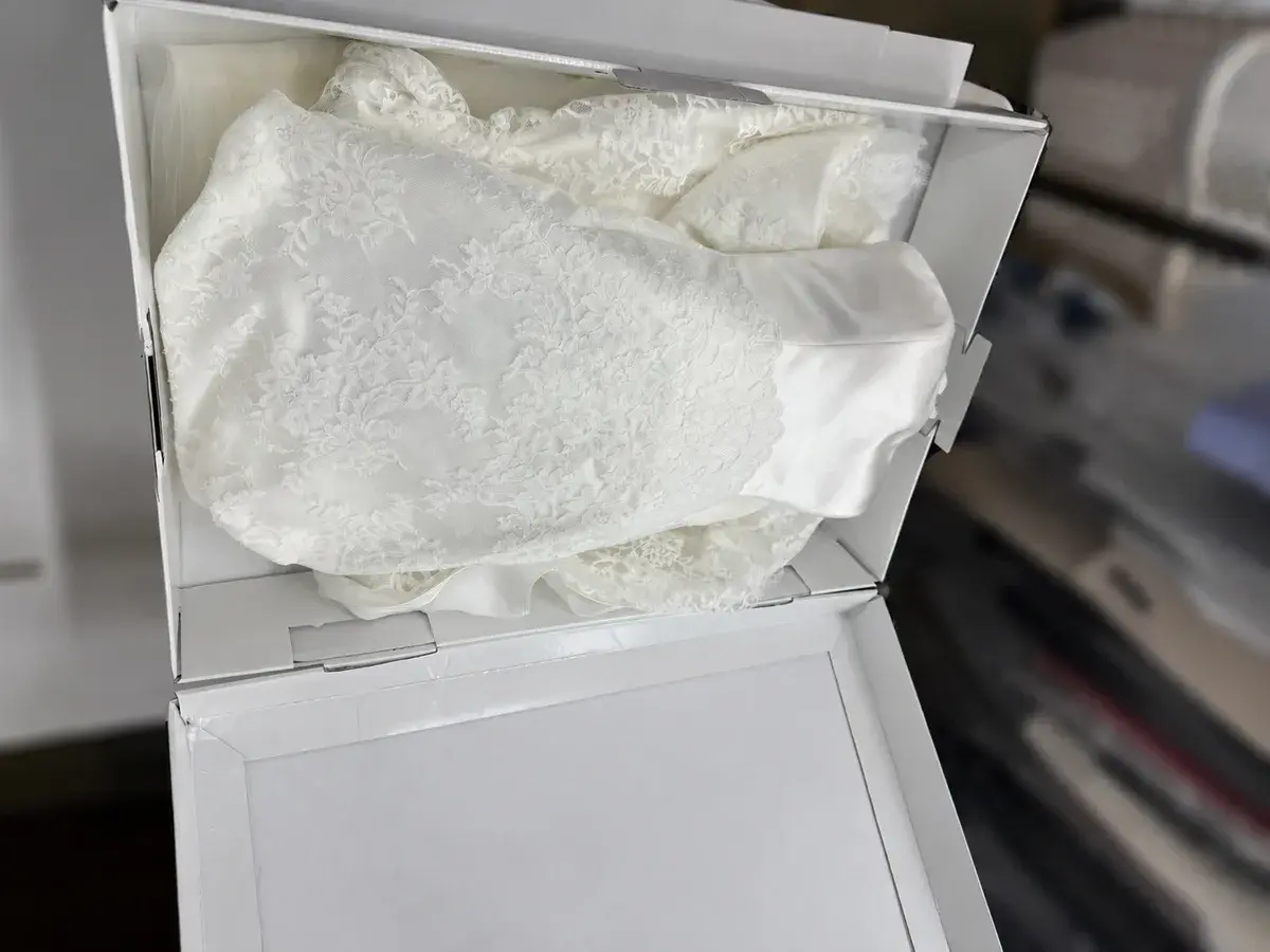 Wedding gown clean and folded in acid-free tissue inside its preservation box at Baroni Cleaners Irvine