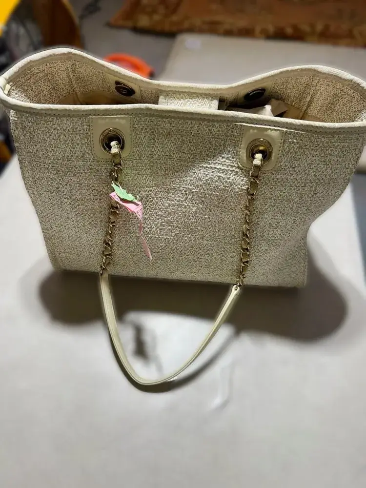 Chanel logo detail on restored Deauville tote bag